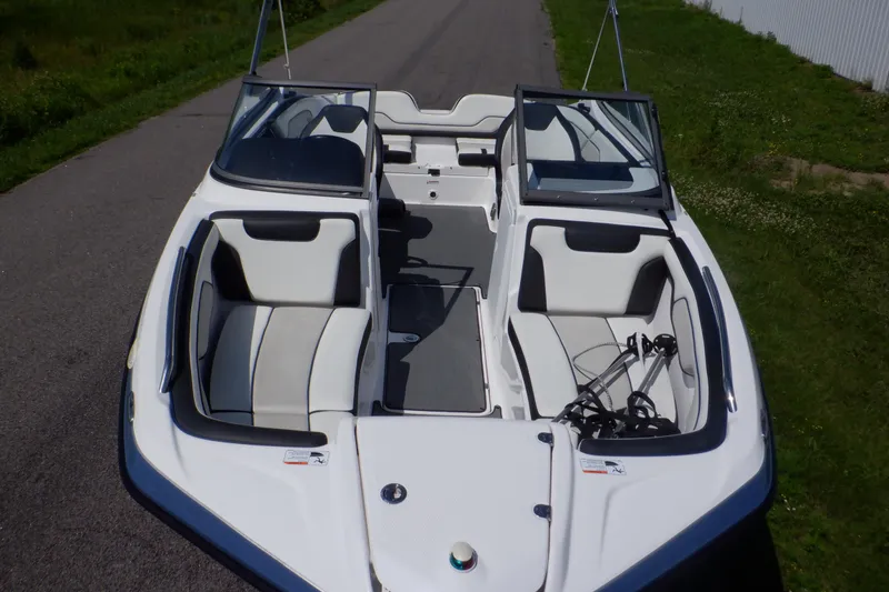 Slide: The Image of 2019 Yamaha Boats SX210 with sleek interior design on a road. - 3