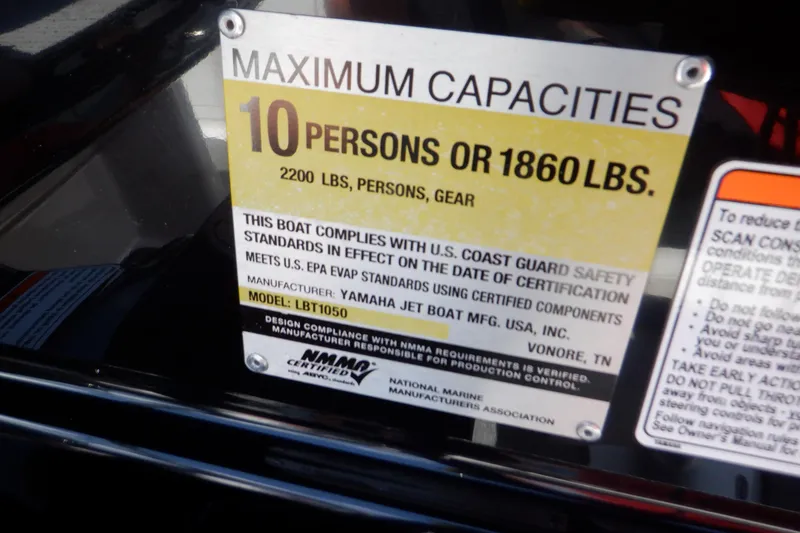 Slide: The Image of 2019 Yamaha Boats SX210 capacity label, maximum 10 persons or 1860 lbs, U.S. Coast Guard compliant. - 32