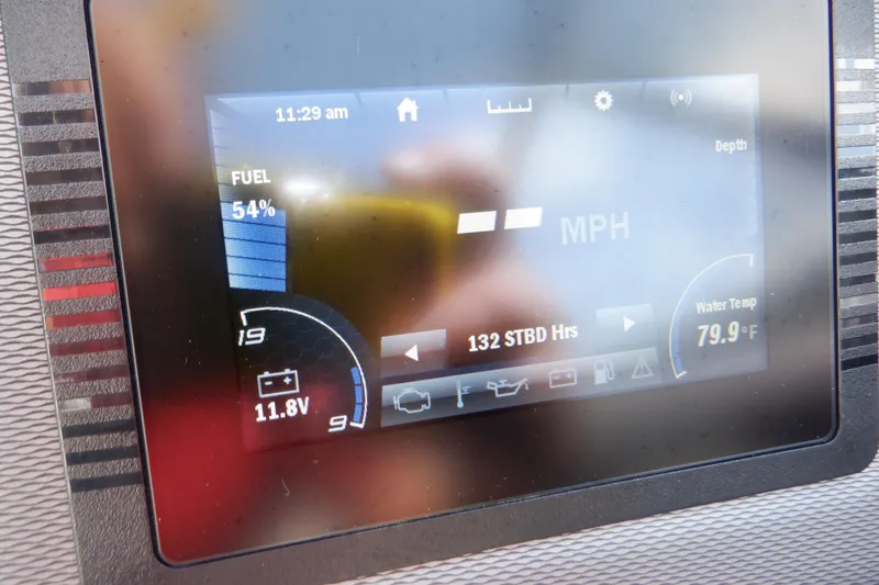 Slide: The Image of Dashboard display of a 2019 Yamaha Boats SX210 showing fuel level and water temperature. - 35