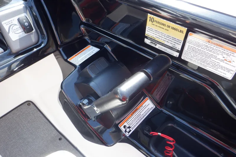 Slide: The Image of 2019 Yamaha SX210 boat throttle control with safety warnings and capacity label. - 37