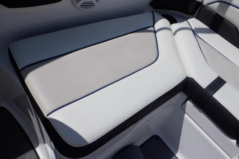 Slide: The Image of 2019 Yamaha SX210 boat interior seating with white and black upholstery. - 40