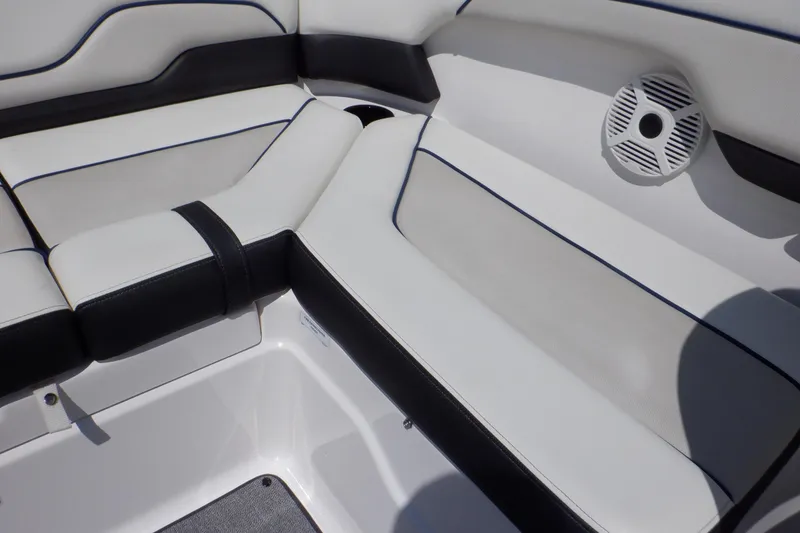 Slide: The Image of 2019 Yamaha Boats SX210 interior seating with speaker, featuring sleek black and white design. - 42