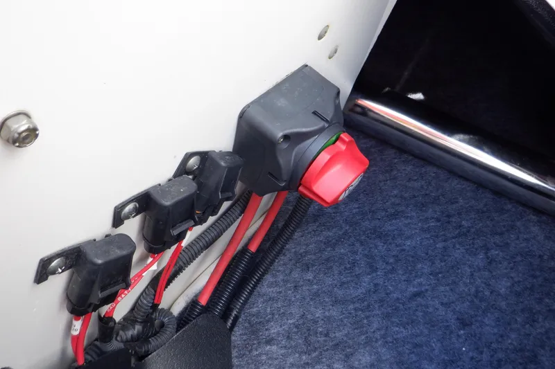 Slide: The Image of 2019 Yamaha SX210 boat electrical panel with red switch and wiring. - 44