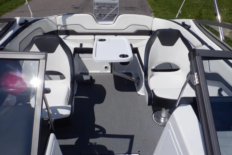 Slide: The Image of 2019 Yamaha Boats SX210 interior with seating and table, showcasing modern design and comfort. - 46
