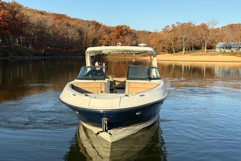 Slide: The Image of 2016 Sea Ray 350 SLX boat interior with modern dashboard and luxurious seating. - 10