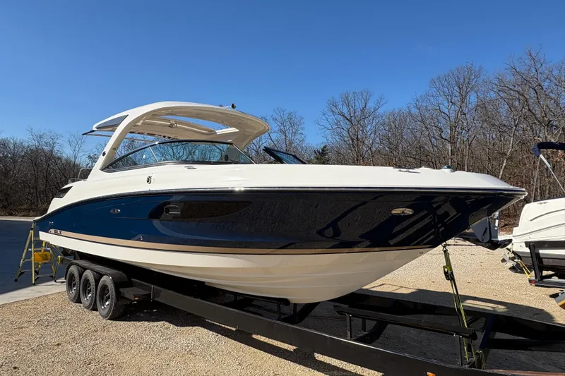 Slide: The Image of Luxurious 2016 Sea Ray 350 SLX boat interior with kitchenette and wooden flooring. - 13