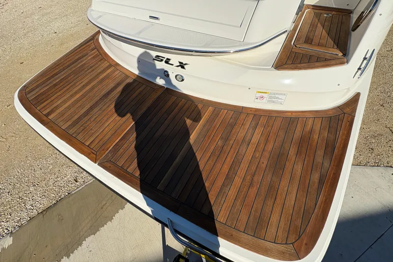 Slide: The Image of Interior of 2016 Sea Ray 350 SLX boat with kitchenette and seating area. - 15