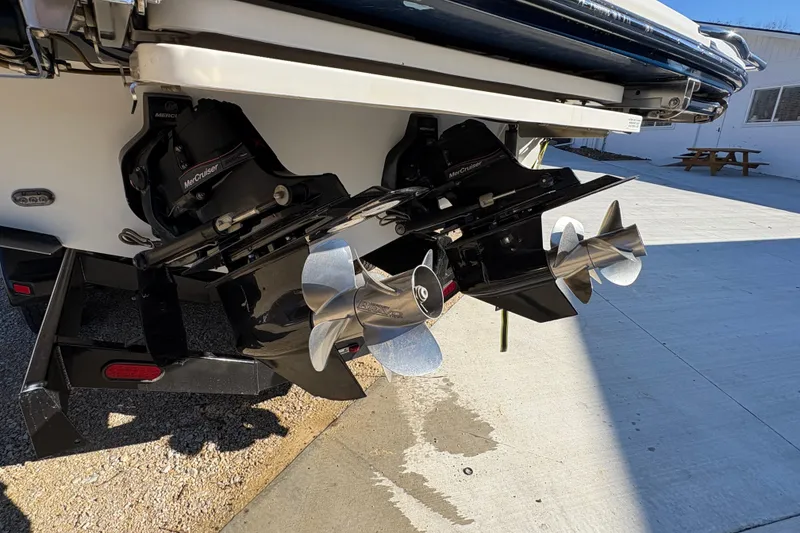 Slide: The Image of Luxurious 2016 Sea Ray 350 SLX boat interior with tan seating and wooden flooring. - 16