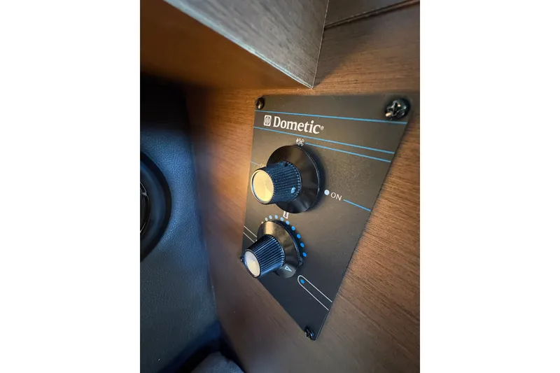 Slide: The Image of Interior of 2016 Sea Ray 350 SLX boat with leather seats and modern dashboard. - 27