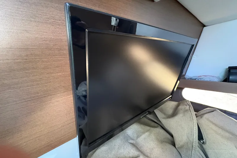 Slide: The Image of Control panel of 2016 Sea Ray 350 SLX boat with joystick and throttle controls. - 28