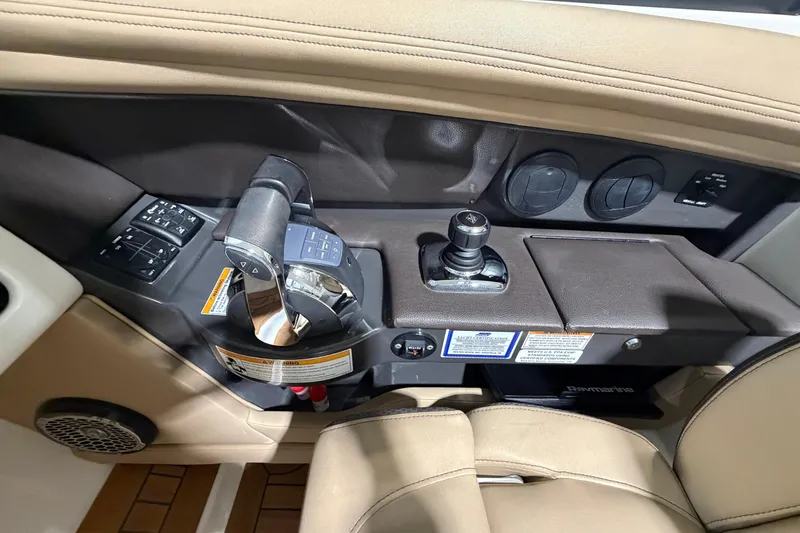 Slide: The Image of 2016 Sea Ray 350 SLX boat interior with luxurious seating in a showroom. - 38