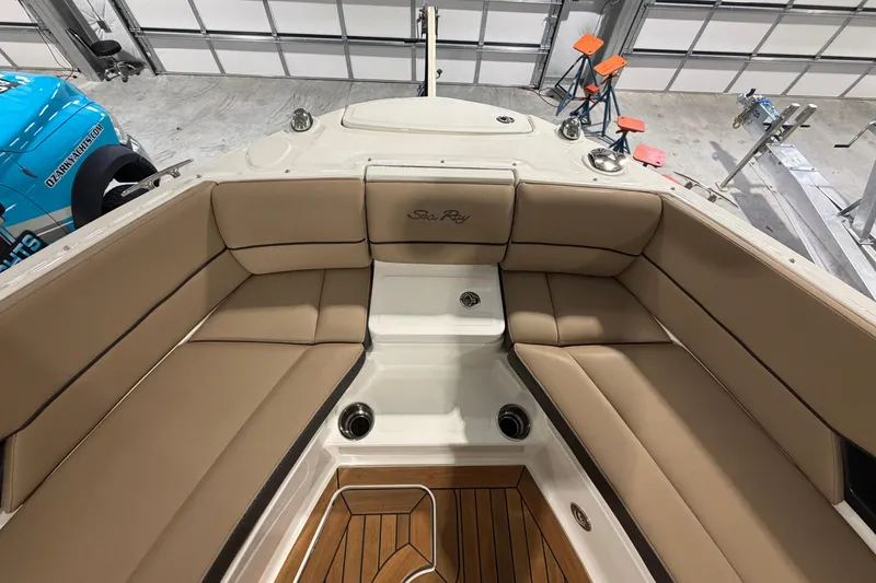 Slide: The Image of 2016 Sea Ray 350 SLX boat interior with blue LED lighting and wooden flooring. - 46