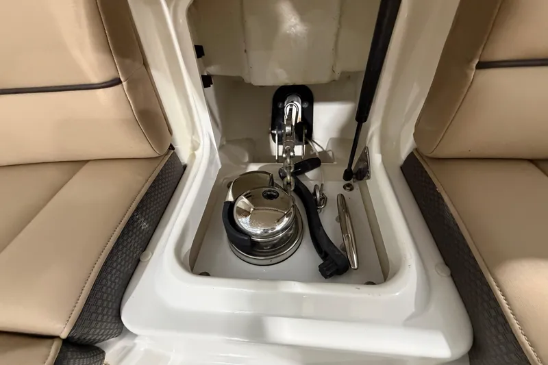Slide: The Image of 2016 Sea Ray 350 SLX boat interior with illuminated storage compartment and wooden flooring. - 47