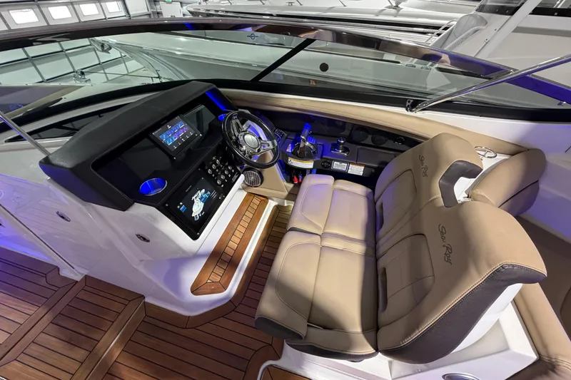 Slide: The Image of Control panel of a 2016 Sea Ray 350 SLX boat with ignition keys and switches. - 52