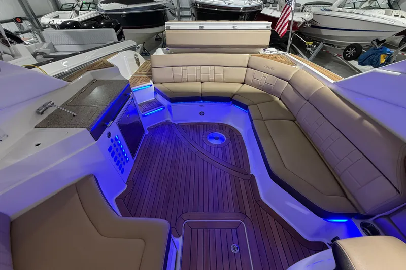 Slide: The Image of Interior cabin of 2016 Sea Ray 350 SLX boat with seating and control panel. - 53