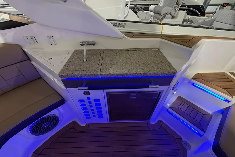 Slide: The Image of Interior cabin of 2016 Sea Ray 350 SLX with TV and seating area. - 56