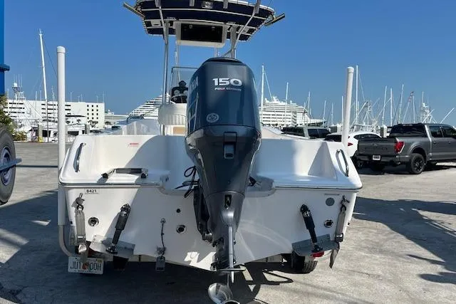 Slide: The Image of 2007 Sea Hunt Triton 207 boat with 150 horsepower engine at marina. - 21