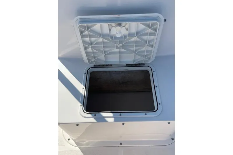 Slide: The Image of Open storage compartment on a 2007 Sea Hunt Triton 207 boat. - 9