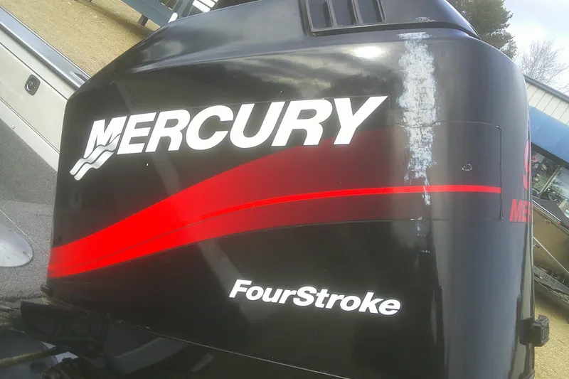 Slide: The Image of Mercury FourStroke engine on 1997 Lund 1660 Pro-V boat, close-up view. - 26