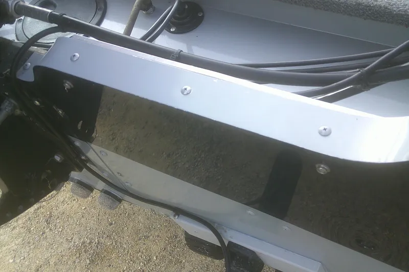 Slide: The Image of 1997 Lund 1660 Pro-V boat transom with cables and hardware. - 27