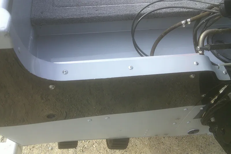 Slide: The Image of 1997 Lund 1660 Pro-V boat interior with visible cables and metal components. - 29