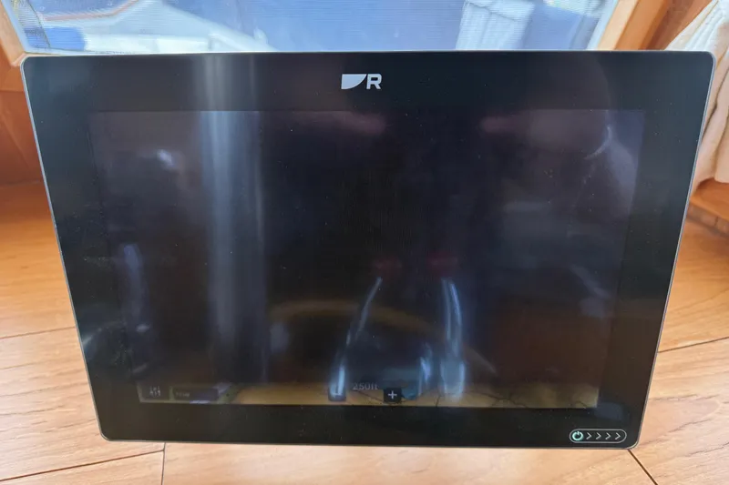 Slide: The Image of Raymarine navigation displays on 1997 Grand Banks Classic boat dashboard, showing speed and heading. - 9