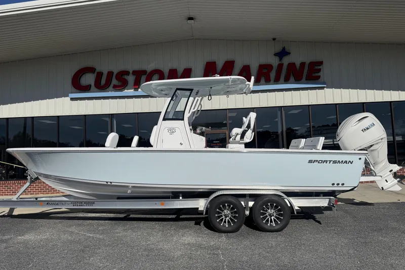 The Image of 2026 Sportsman Masters 267 Bay Boat on trailer at Custom Marine dealership. - 1