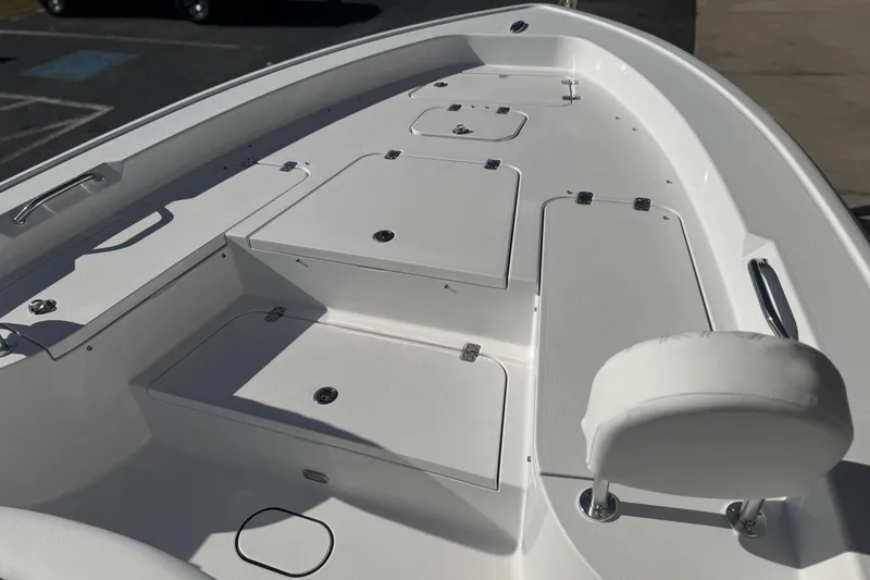 Slide: The Image of 2026 Sportsman Masters 267 Bay Boat interior with storage compartments and seating. - 10