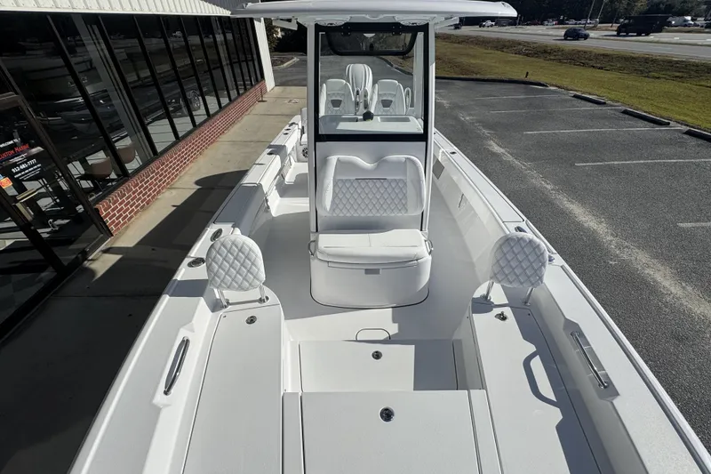Slide: The Image of 2026 Sportsman Masters 267 Bay Boat with sleek white interior and modern design. - 12