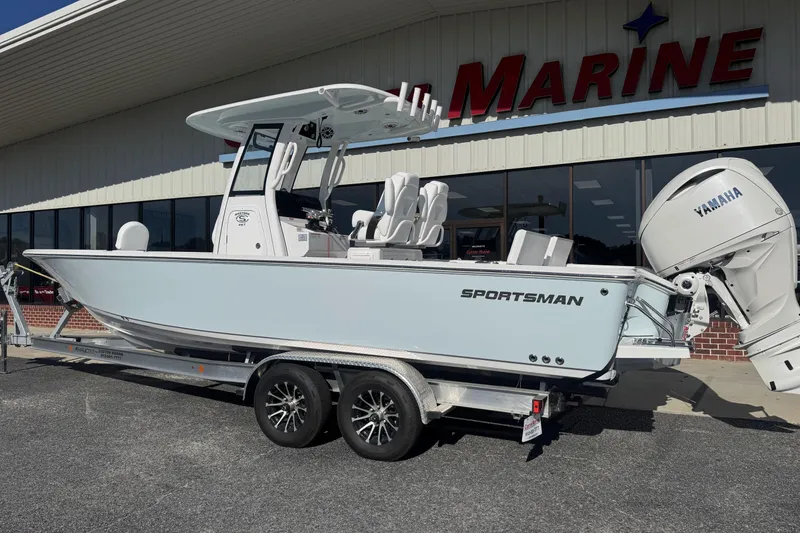 Slide: The Image of 2026 Sportsman Masters 267 Bay Boat on trailer outside marine dealership. - 2