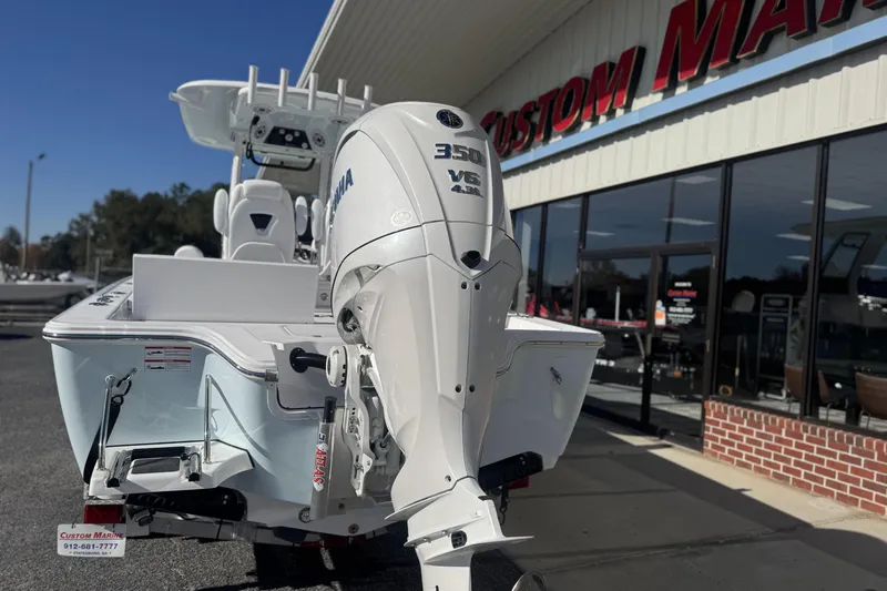 Slide: The Image of 2026 Sportsman Masters 267 Bay Boat with Yamaha 350 V6 engine at Custom Marine dealership. - 4