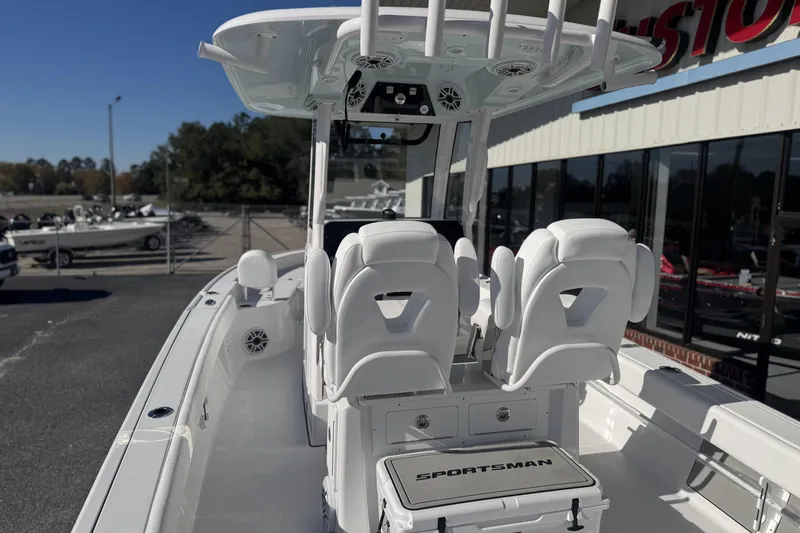 Slide: The Image of 2026 Sportsman Masters 267 Bay Boat interior with white seating and console. - 9