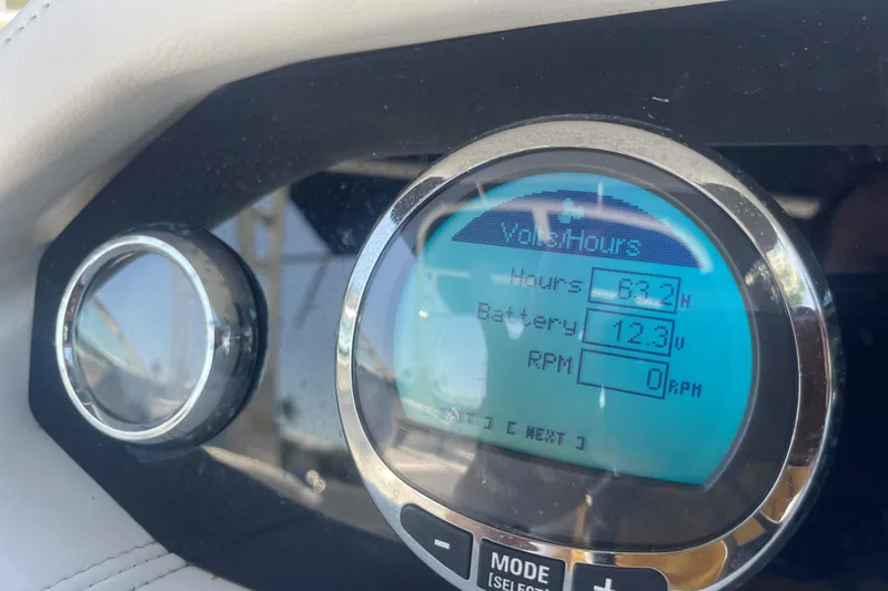 Slide: The Image of Dashboard display of 2023 Four Winns HD5 OB showing hours, battery, and RPM. - 11