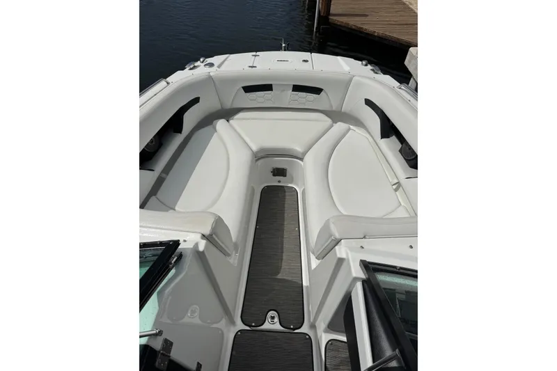 Slide: The Image of 2023 Four Winns HD5 OB boat interior with white seating and sleek design. - 12