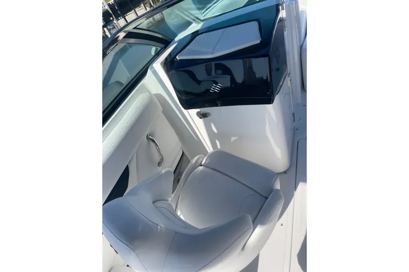 Slide: The Image of 2023 Four Winns HD5 OB boat interior with white seating and sleek design. - 15