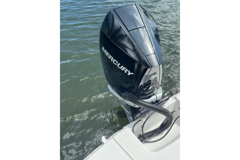 Slide: The Image of 2023 Four Winns HD5 OB with Mercury outboard motor on water. - 21