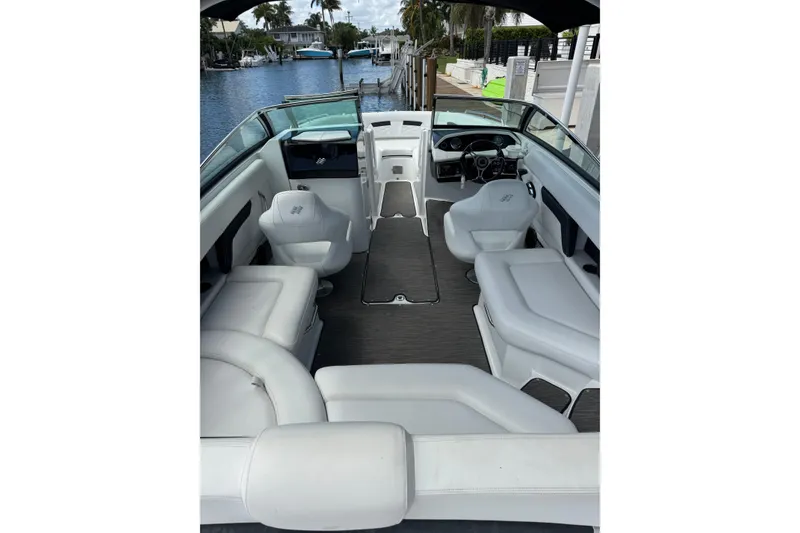 Slide: The Image of 2023 Four Winns HD5 OB boat interior with white seating and sleek design. - 7