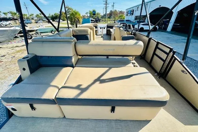 Slide: The Image of 2021 Harris 250 Cruiser pontoon boat with spacious seating and modern design. - 13