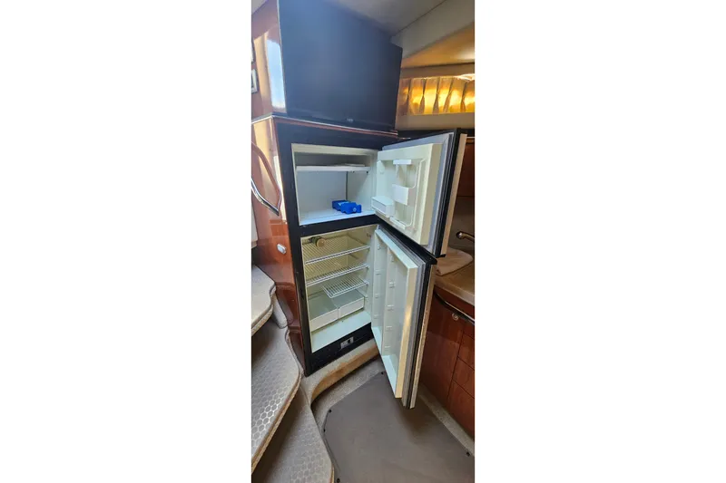 Slide: The Image of Open refrigerator inside 2004 Sea Ray 380 Sundancer yacht cabin. - 14