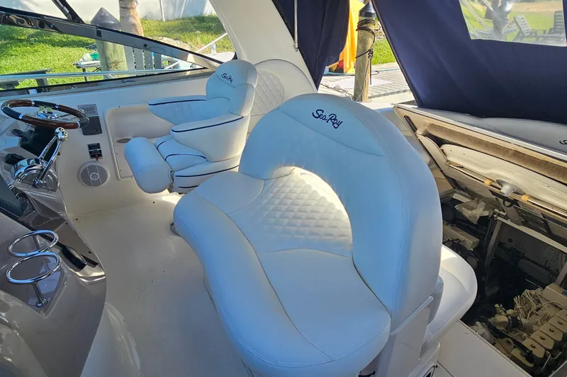 Slide: The Image of Luxurious interior of 2004 Sea Ray 380 Sundancer with plush white seating. - 3