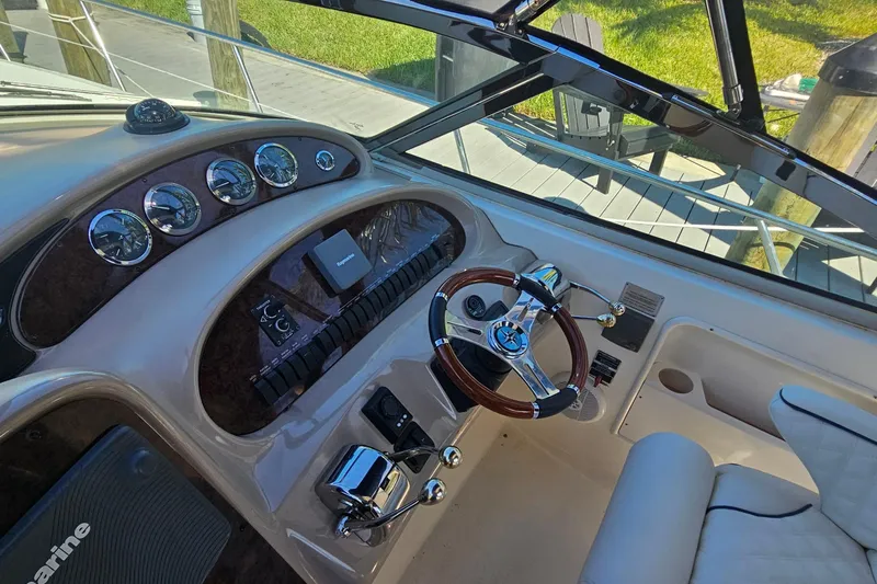 Slide: The Image of Helm of 2004 Sea Ray 380 Sundancer with gauges and steering wheel. - 4