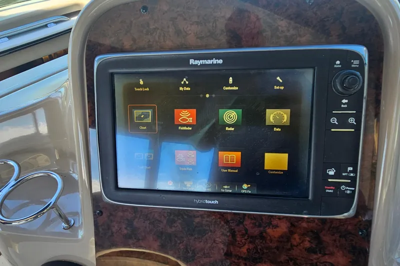 Slide: The Image of Raymarine display on 2004 Sea Ray 380 Sundancer boat dashboard, showing navigation options. - 7