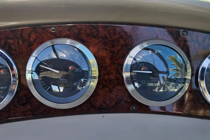 Slide: The Image of Dashboard gauges of a 2004 Sea Ray 380 Sundancer boat. - 8