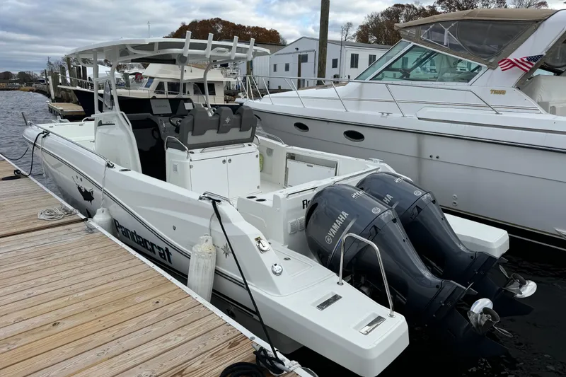 The Image of 2023 Jeanneau Leader 9.0 CC boat docked with twin Yamaha outboard engines. - 0