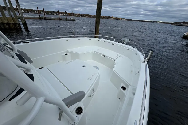 Slide: The Image of 2023 Jeanneau Leader 9.0 CC boat docked on a cloudy day. - 6