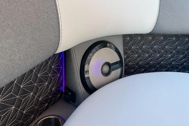 Slide: The Image of Luxurious interior of 2026 Alera M23Q with stylish speaker and geometric upholstery design. - 11