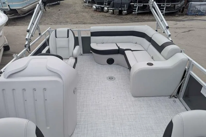 Slide: The Image of 2025 South Bay 16FC SE S Entertainment pontoon boat interior with plush seating. - 10
