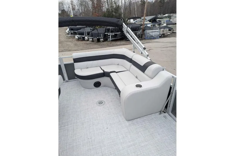 Slide: The Image of 2025 South Bay 16FC SE S Entertainment pontoon boat with stylish seating and cup holders. - 11