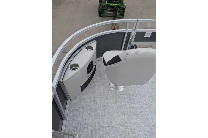 Slide: The Image of 2025 South Bay 16FC SE S Entertainment boat interior with seating and cup holders. - 12