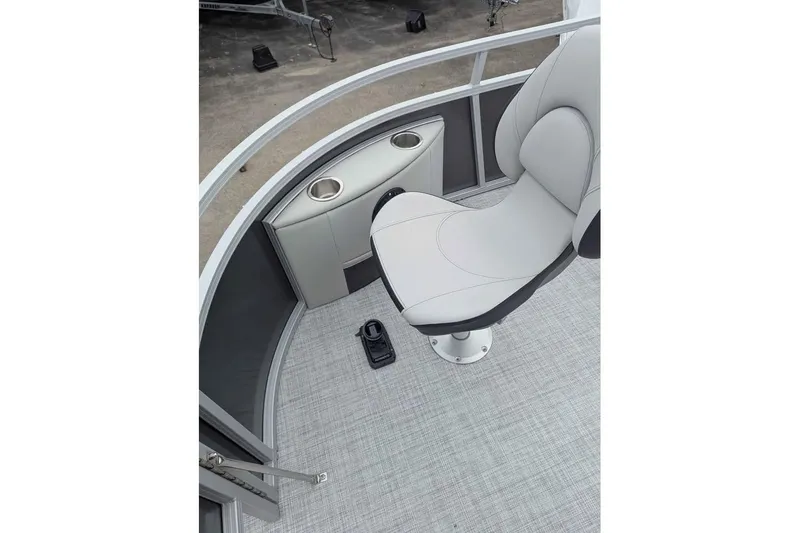 Slide: The Image of 2025 South Bay 16FC SE S Entertainment boat interior with seating and cup holders. - 13